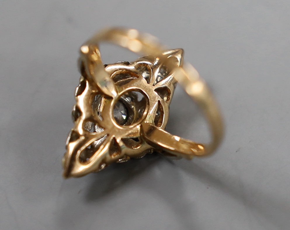 A 1950's Soviet 583 yellow metal (14k) and diamond set marquise cluster ring, size P/Q, gross weight 4.1 grams.